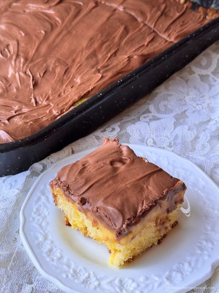 Boston Cream Poke cake, piece on a plate