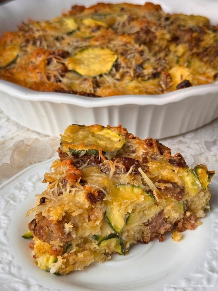 Impossible Zucchini Pie with sausage, slice on a plate